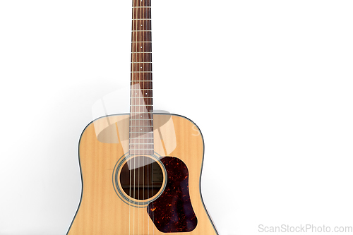 Image of close up of acoustic guitar on white background
