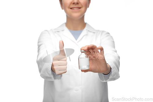 Image of close up of doctor with medicine showing thumbs up