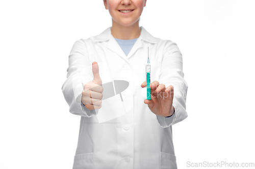 Image of close up of doctor with syringe showing thumbs up