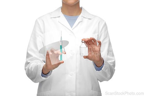 Image of close up of doctor with medicine and syringe