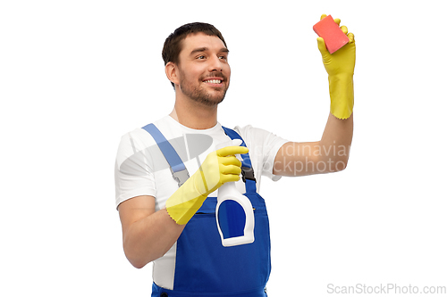 Image of male cleaner cleaning with sponge and detergent