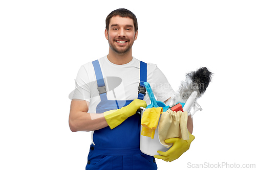 Image of male cleaner in overall with cleaning supplies