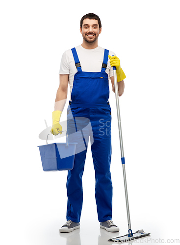 Image of male cleaner cleaning floor with mop and bucket