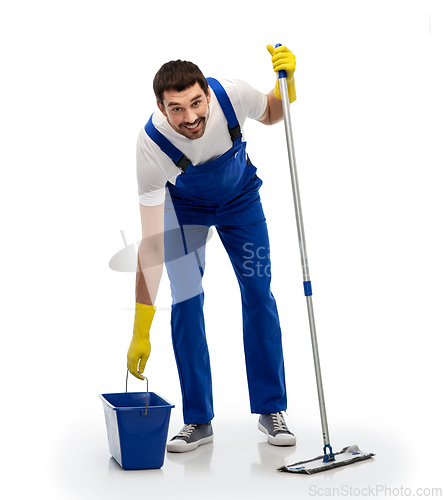 Image of male cleaner cleaning floor with mop and bucket