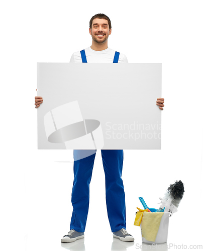 Image of male cleaner with cleaning stuff and white board