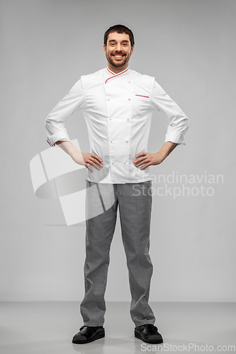 Image of happy smiling male chef in jacket