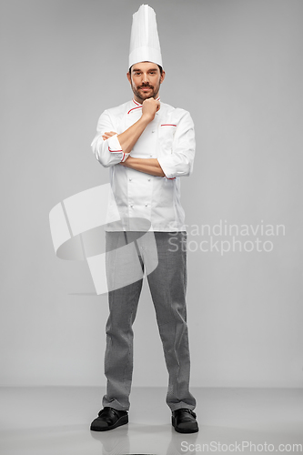 Image of happy male chef in toque