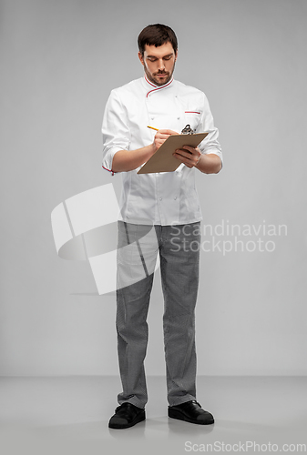 Image of male chef with clipboard and pencil