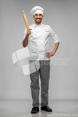 Image of happy smiling male chef or baker with rolling pin