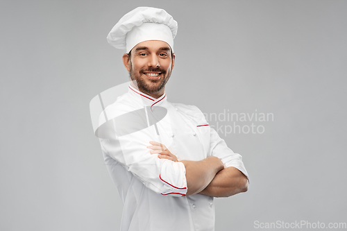 Image of happy smiling male chef in toque
