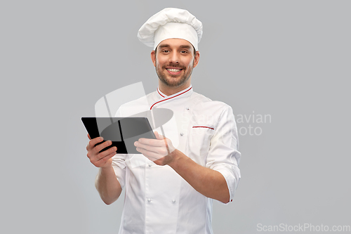 Image of happy smiling male chef with tablet pc computer