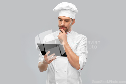 Image of male chef with tablet pc computer