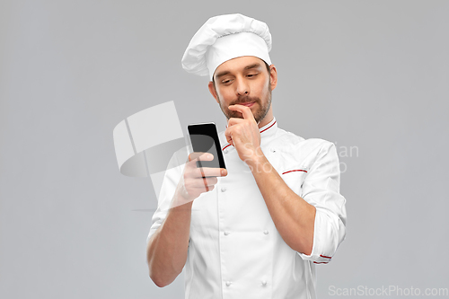 Image of male chef with smartphone
