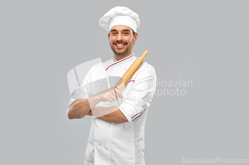 Image of happy smiling male chef or baker with rolling pin