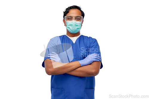 Image of indian male doctor in blue uniform and mask