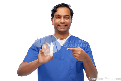 Image of smiling indian male doctor or nurse with medicine