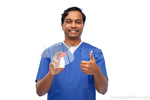 Image of smiling indian male doctor or nurse with medicine