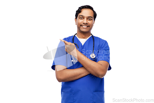 Image of indian male doctor holding something on hand
