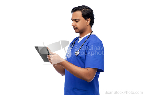Image of indian doctor or male nurse using tablet computer