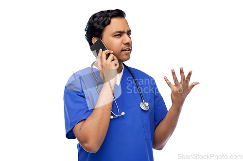 Image of indian doctor or male nurse calling on smartphone