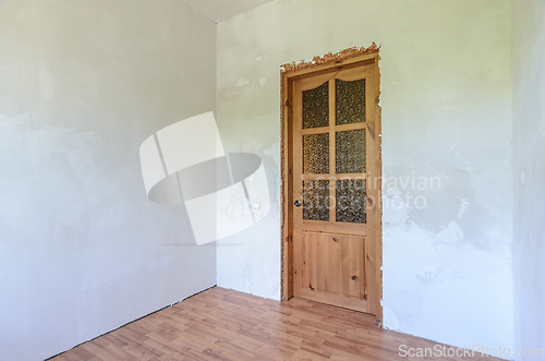 Image of View of the front door in a small room after renovation