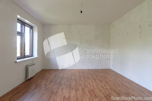 Image of Interior of a small empty room with one window during renovation