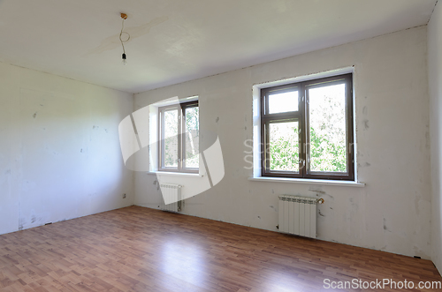 Image of A fragment of a room with a fine finish, a view of two windows