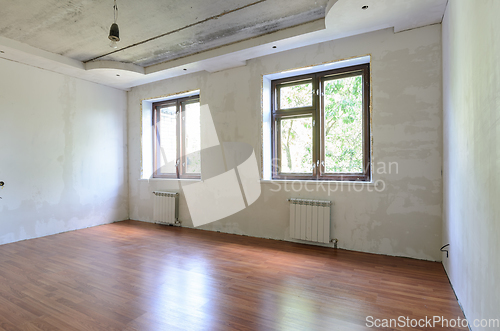 Image of Empty room interior, wall view with windows