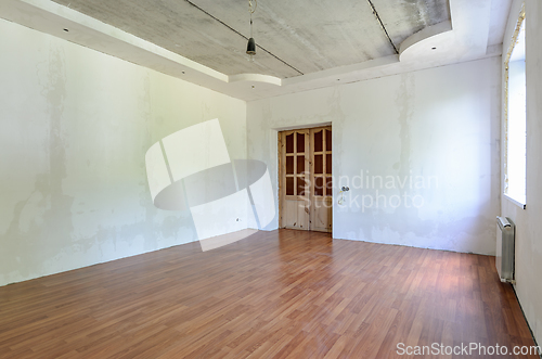 Image of Interior of an empty room prepared for wallpapering