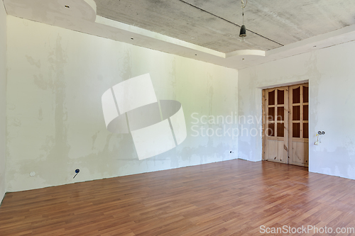 Image of Interior of an empty room with a final renovation under a wallpaper sticker