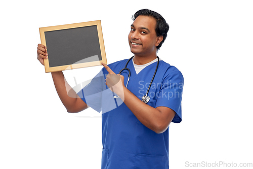 Image of happy indian male doctor or nurse with chalkboard