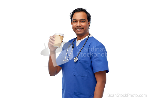 Image of male doctor with stethoscope drinking coffee