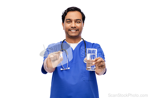 Image of indian doctor with medicine and glass of water