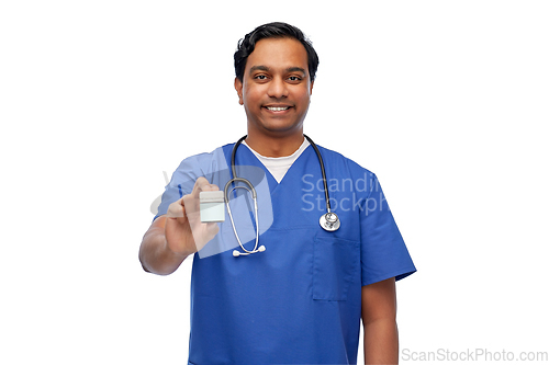 Image of indian doctor or male nurse holding medicine