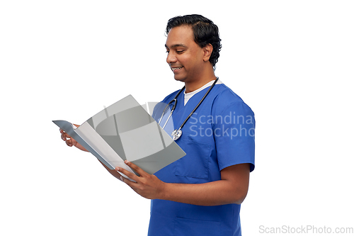 Image of happy indian doctor with medical report in folder