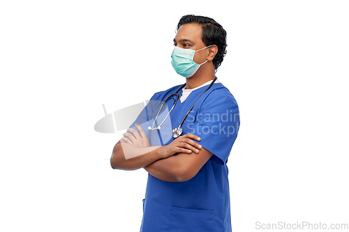 Image of indian male doctor in blue uniform and mask