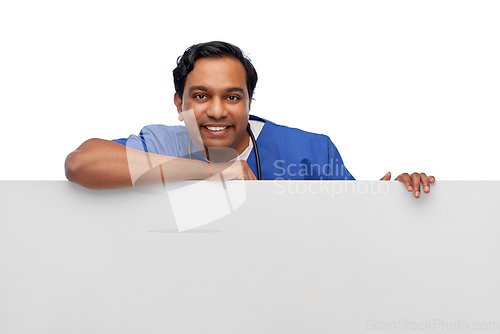 Image of smiling male doctor or nurse with big white board