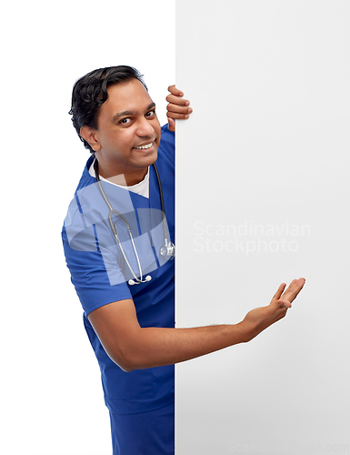 Image of smiling male doctor or nurse with big white board