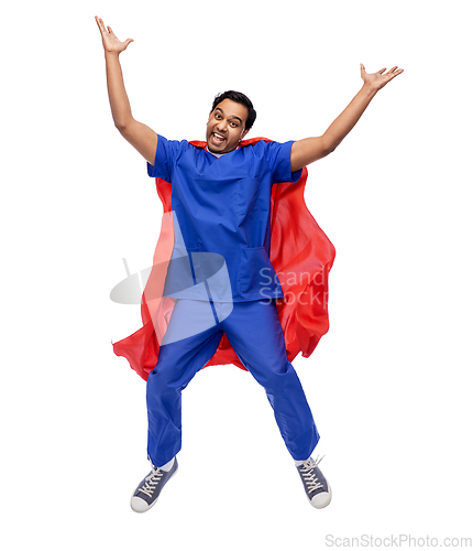 Image of doctor or male nurse in superhero cape jumping
