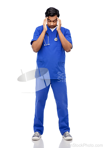 Image of stressed doctor or male nurse having headache