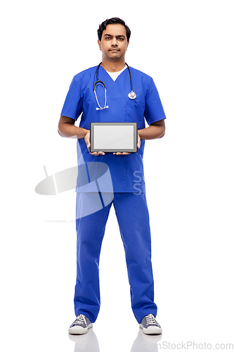 Image of indian doctor or male nurse showing tablet pc