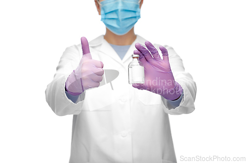 Image of close up of doctor with medicine showing thumbs up