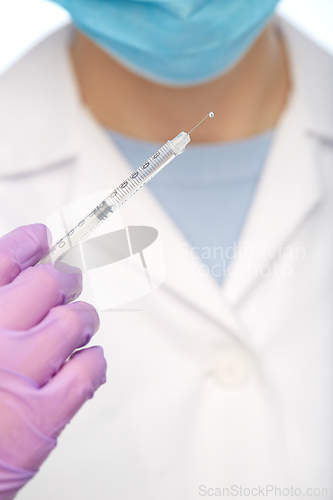 Image of close up of doctor with syringe