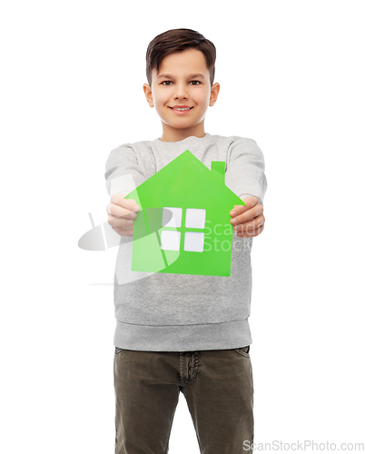 Image of smiling boy holding green house icon