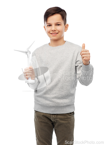 Image of smiling boy with toy wind turbine