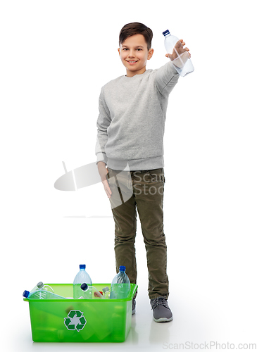 Image of smiling boy sorting plastic waste