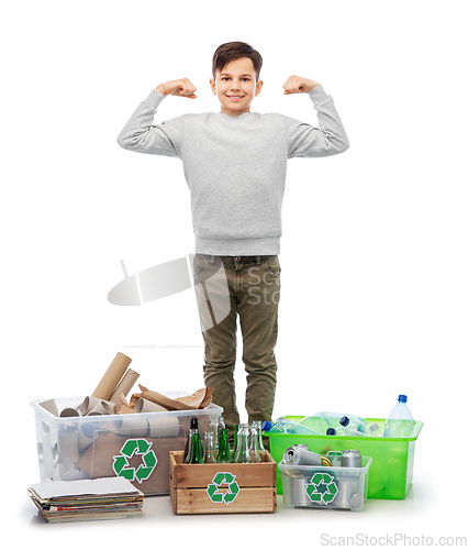 Image of smiling boy sorting paper, metal and plastic waste