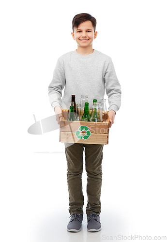 Image of smiling boy with wooden box sorting glass waste