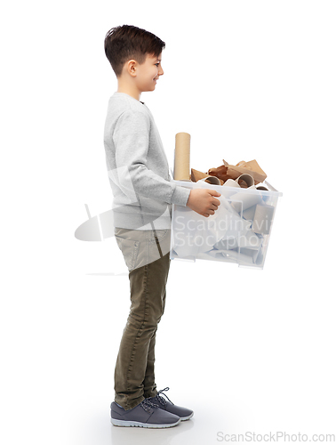 Image of smiling boy sorting paper waste