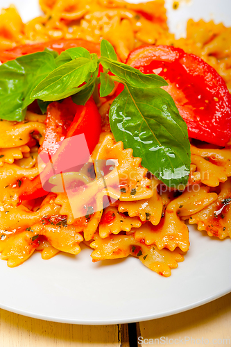 Image of Italian pasta farfalle butterfly bow-tie and tomato sauce